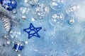 Christmas balls with starry pattern, glass star and drum on blue Royalty Free Stock Photo