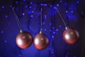 christmas balls swinging like a pendulum on a background of blue lights Royalty Free Stock Photo