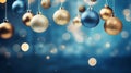 Christmas balls and toys on a blue and gold background with bokeh lights on Christmas Eve. Royalty Free Stock Photo