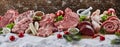 Christmas banner with assorted raw meat for a BBQ