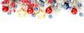 Christmas banner background. Xmas border composition with Christmas tree branch, red holly berries and gold garland isolated