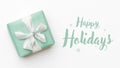 Christmas banner. Beautiful christmas gift isolated on white background. Turquoise colored wrapped xmas box. Gift wrapping. Royalty Free Stock Photo