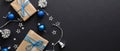 Christmas banner. Black Xmas background blue and silver bright decorations, gifts box, balls. Christmas postcard, greeting card Royalty Free Stock Photo