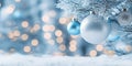 Christmas banner with elegant blue bauble ornaments hanging on snow covered tree Royalty Free Stock Photo