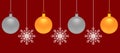 Gold and silver Christmas balls and snowflakes on a red background. Royalty Free Stock Photo