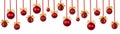 Christmas banner - pattern of bright red christmas balls, gold bows hang on ribbon in row isolated on white background. Christmas. Royalty Free Stock Photo