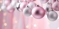 Christmas banner with pink and white tree bauble ornaments and snow covered tree Royalty Free Stock Photo