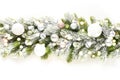 Christmas banner of garland with white baubles on snowy evergreen branches.