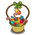 Christmas basket with candies, lollipops and balls Royalty Free Stock Photo