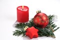 A christmas bauble, a christmas star and a candle