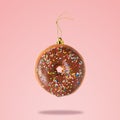 Christmas bauble decoration made of chocolate doughnut