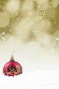 Christmas bauble on golden defocused lights Royalty Free Stock Photo