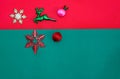 Christmas bauble,snow flake ,presents ,reindeer and leaves on Red green background with snow fall,top  view with copy space Royalty Free Stock Photo