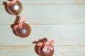 Christmas baubles with bows on wooden background Royalty Free Stock Photo