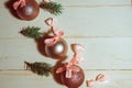 Christmas baubles with bows on wooden background Royalty Free Stock Photo