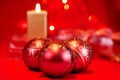 Christmas baubles and candle