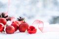 Christmas - Baubles Decorated, red xmas balls, Pine And Snowflakes In Snowing Background Royalty Free Stock Photo