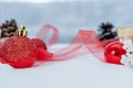 Christmas - Baubles Decorated, red xmas balls, Pine And Snowflakes In Snowing Background Royalty Free Stock Photo