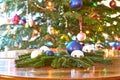 Christmas, baubles and evergreens on table, Christmas tree