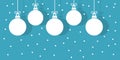 Christmas baubles hanging white ornaments on blue snowing winter background Royalty Free Stock Photo