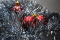 Christmas baubles nesting in silver tinsel 3