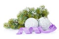 Christmas baubles and purple ribbon with snow fir tree Royalty Free Stock Photo