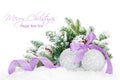 Christmas baubles and purple ribbon with snow fir tree Royalty Free Stock Photo