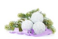 Christmas baubles and purple ribbon with snow fir tree Royalty Free Stock Photo