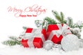 Christmas baubles and red gift boxes with snow fir tree Royalty Free Stock Photo