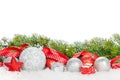 Christmas baubles and red ribbon with snow fir tree Royalty Free Stock Photo