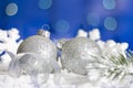 Christmas baubles and silver ribbon on snow Royalty Free Stock Photo