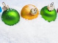 Christmas baubles in snow Royalty Free Stock Photo