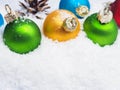 Christmas baubles in snow Royalty Free Stock Photo