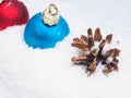 Christmas baubles in snow Royalty Free Stock Photo