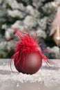 Christmas baubles on a table with an out of focus Christmas tree at the back. Christmas holiday and