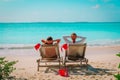 Christmas on beach -chair lounges and happy couple relax at sea Royalty Free Stock Photo