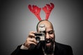 Christmas bearded man holding old camera Royalty Free Stock Photo