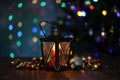 Christmas. A beautiful lantern on a background of colored lights. Royalty Free Stock Photo