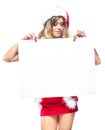 Christmas. Beautiful muscular sexual happy woman in Santa Claus clothes. Keeps blank whiteboard. Isolated on white