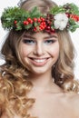 Christmas beauty woman. Positive friendly model with makeup, clean fresh skin, wavy blonde hair, perfect smile and Xmas New Year