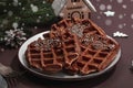 Christmas Belgian waffles with chocolate. Festive New Year dessert, traditional arrangement