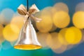 Christmas bell on the background of bokeh lights with copy space Royalty Free Stock Photo