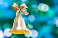 Christmas bell on the background of bokeh lights with copy space Royalty Free Stock Photo