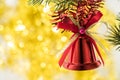 Christmas bell ornament hang on tree branch with yellow bokeh ba Royalty Free Stock Photo