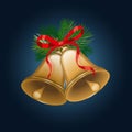 Christmas bells with pine twigs and red bow on dark blue background. Royalty Free Stock Photo