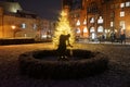 Sculpture Girl with ball in front of the lit Christmas tree in front of the Rathaus KÃÂ¶penick. Berlin, Germany Royalty Free Stock Photo