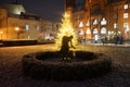 Sculpture Girl with ball in front of the lit Christmas tree in front of the Rathaus KÃÂ¶penick. Berlin, Germany Royalty Free Stock Photo