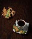 Christmas biscuits and cup of fresh black coffee Royalty Free Stock Photo