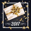 Christmas black greeting card with gift box and gold bow. Happy New Year decoration with confetti and stars. Christmas Royalty Free Stock Photo