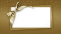 Christmas Blank gift greeting card ticket with shiny golden ribbon bow, isolated on beige background with sparkle stars, top view